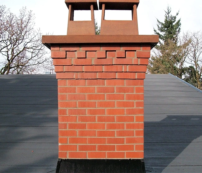 Self-Cleaning Chimney Caps: Do They Really Work? 2026 Technology Guide Top Notch Brick Chimney Restoration 650 by 556 | Florida - Fireplace & Chimney Services